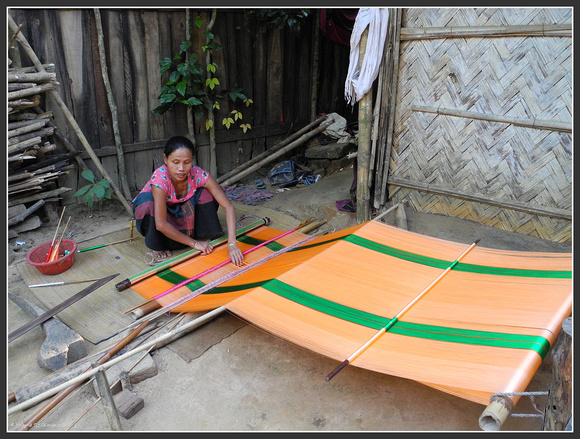 Chakma lady weaving a cloth